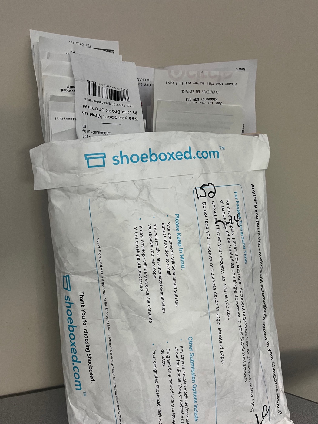 A Shoeboxed Magic Envelope stuffed with receipts, ready to scan